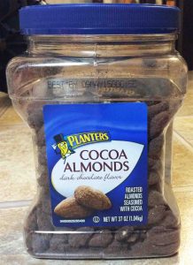 Picture of the front of a 37 ounce jar of Planters Cocoa Dark Chocolate Roasted Almonds. 